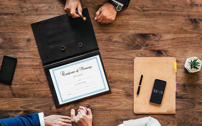 couple signed marriage certificate