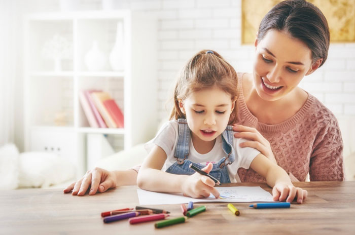Mother teaching her daughter
