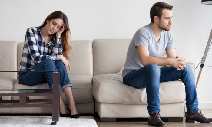 Unhappy couple on couch