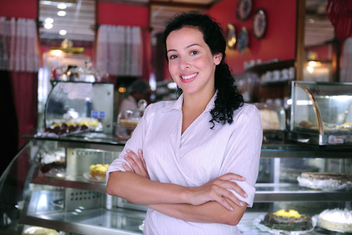 Proud and confident owner of a shop