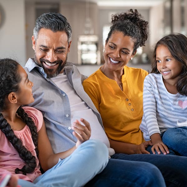family of four on couch
