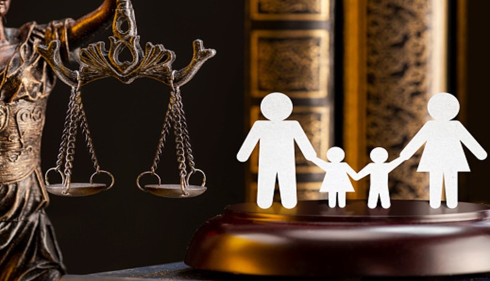 The Concept of Family Law, Symbolized by the Scales of Justice and a Paper-Cutout Family