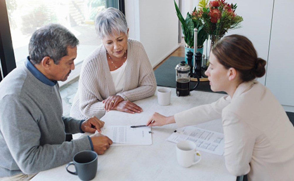 A Couple Is Having a Discussion with a Lawyer About the Estate Will